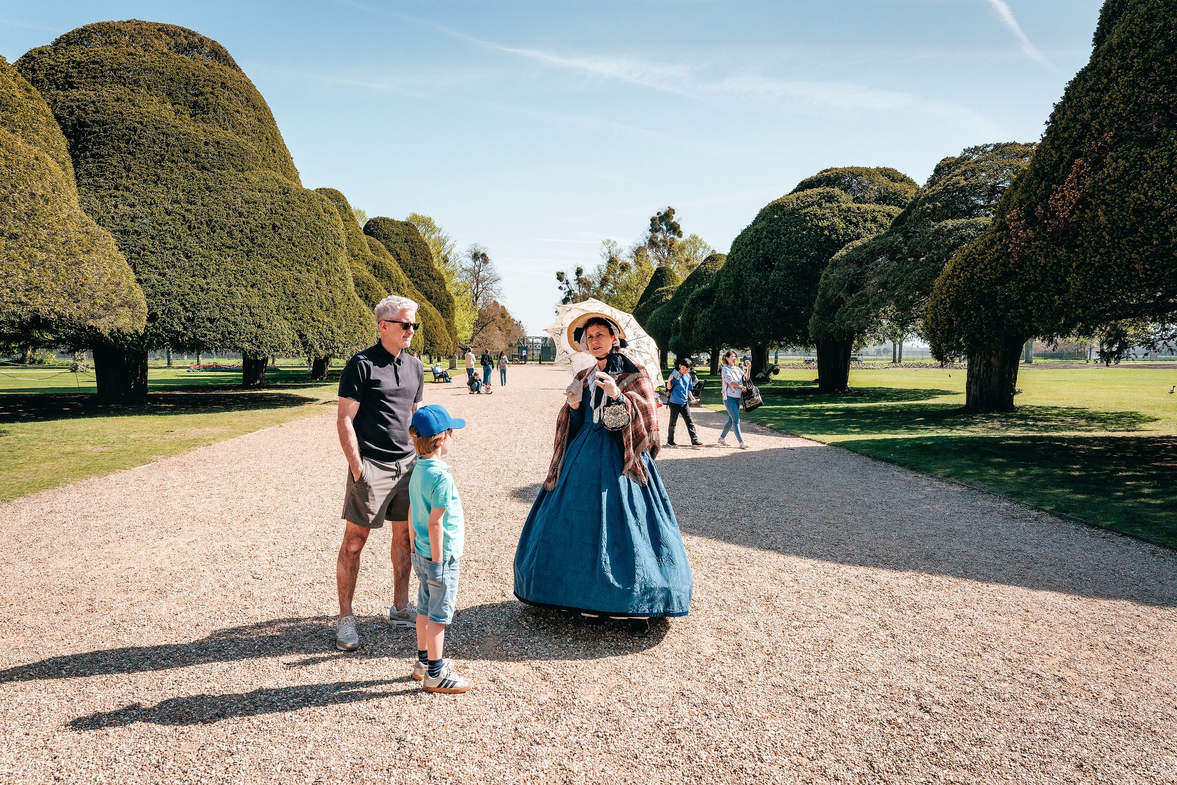 A visitor talking to a volunteer dressed as Queen Victoria